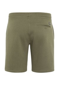 Olive green shorts made of soft material, featuring a back pocket and elastic waistband with a subtle brand label on the side.