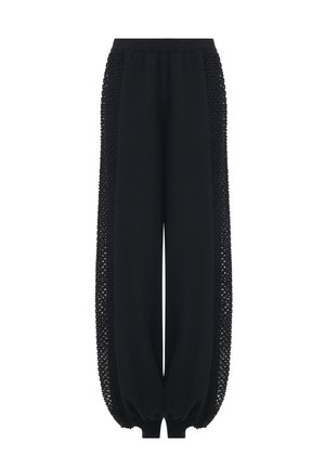 Schwarze weit geschnittene Hosen mit strukturierten Netzseiteneinsätzen sowie elastischen Bündchen und Taillenbund.