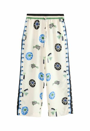 White wide-leg pants with blue and black circular patterns, green and black fish, birds, and blue scalloped side stripes.