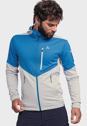 Blue and gray zip-up jacket with a high collar, textured fabric, two side pockets, and a chest pocket, featuring contrasting color blocking.