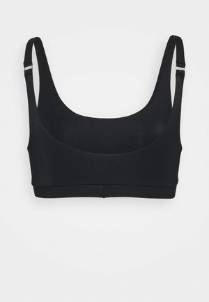 Sort sportstop med justerbare tynde skulderstropper og en rund halsudskæring på en ensartet hvid baggrund.