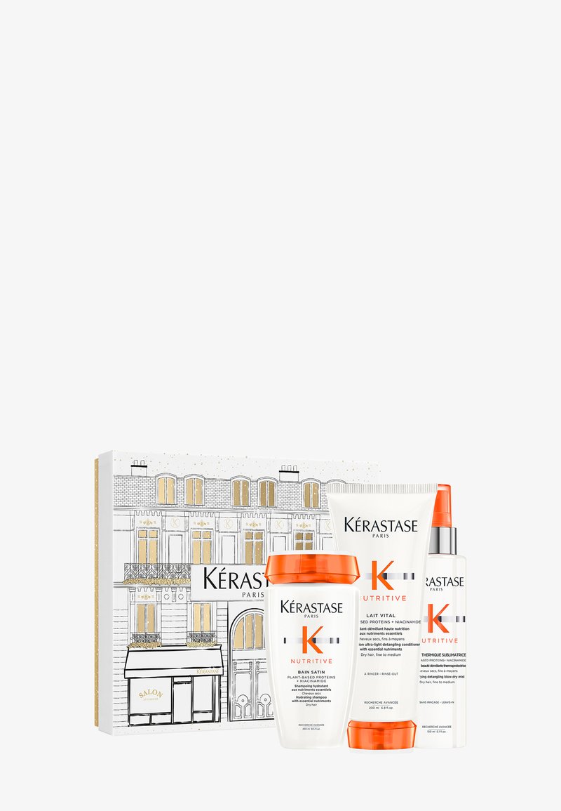 A Kérastase Nutritive ajándékszett egy díszdobozban három terméket tartalmaz: egy fehér tárolót narancssárga fedéllel, egy tubust és egy permetező flakont.