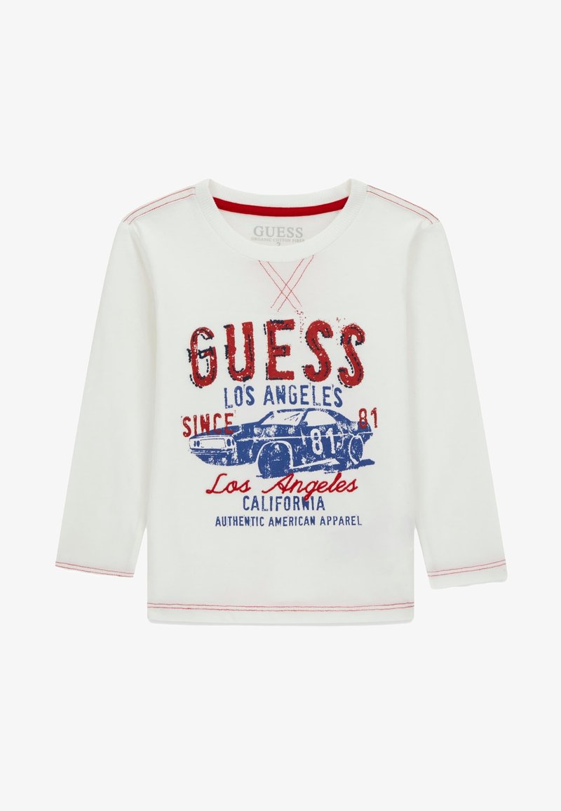 Langärmliges weißes Shirt aus Bio-Baumwolle mit roter und blauer Grafik eines Autos und Text. Mit roten Nähten am Ausschnitt und den Bündchen akzentuiert.