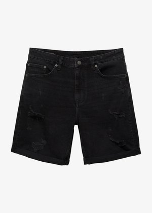 Černé džíny šortky s uvolněným střihem, které mají distressed detaily, pět kapsový design a ohrnuté lemy.