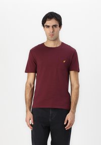 Maroon cotton t-shirt with a round neckline, short sleeves, and a chest pocket featuring a small yellow logo detail.