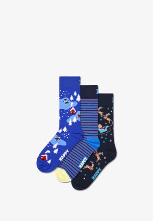 Sada tří ponožek: modré s zimní scénou, pruhované námořnické a světle modré, a tmavě modré se Santou a soby. Směs bavlny.