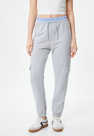 Grå sweatpants med en lyseblå elastisk talje, snorelukning, sidelommer og tapered cuffs, lavet af blødt, struktureret stof.