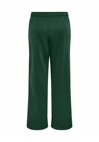 Grønne, vide sweatpants med elastisk talje, lavet af et blødt stof. Har en glat overflade uden synlige lommer eller detaljer.