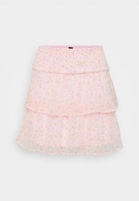 Jupe rose à couches, faite de tissu transparent avec des motifs floraux aux couleurs pastel. La taille élastique améliore le confort et l'ajustement.