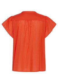 Haut rouge à manches courtes avec une coupe ample, encolure ronde et un dos plissé. Fabriqué en tissu léger et texturé.