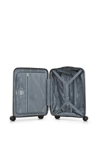 Hard-shell suitcase in grey with four wheels; zipper closure, lined interior featuring a mesh pocket, and straps for securing items.