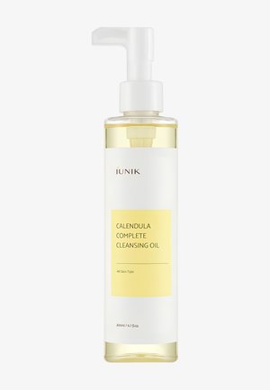 Flacon en plastique transparent avec pompe blanche contenant une huile nettoyante jaune au calendula, étiquetée pour tous types de peau, capacité 200 ml.