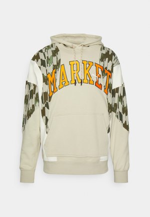 Beige hoodie with "MARKET" in orange, featuring quilted green and white patterned sleeves, drawstring hood, and kangaroo pocket.