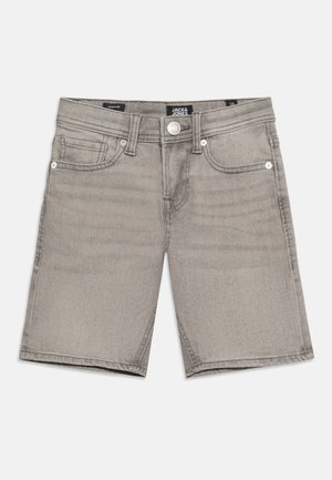 Heledad hallid teksapüksid, millel on nööp- ja tõmblukukinnitus, vööaasad ning esist taskud, asetatud sirgelt valgele taustale.