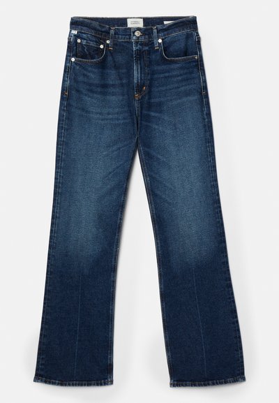 Dark blue denim jeans, wide-leg cut, five-pocket style, visible stitching accents, and a smooth texture with slight fading.