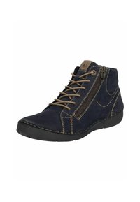 Bottines en daim bleu marine avec des lacets marron, un contraste de couture beige et une fermeture éclair sur le côté. Semelle en caoutchouc pour la stabilité et le confort.