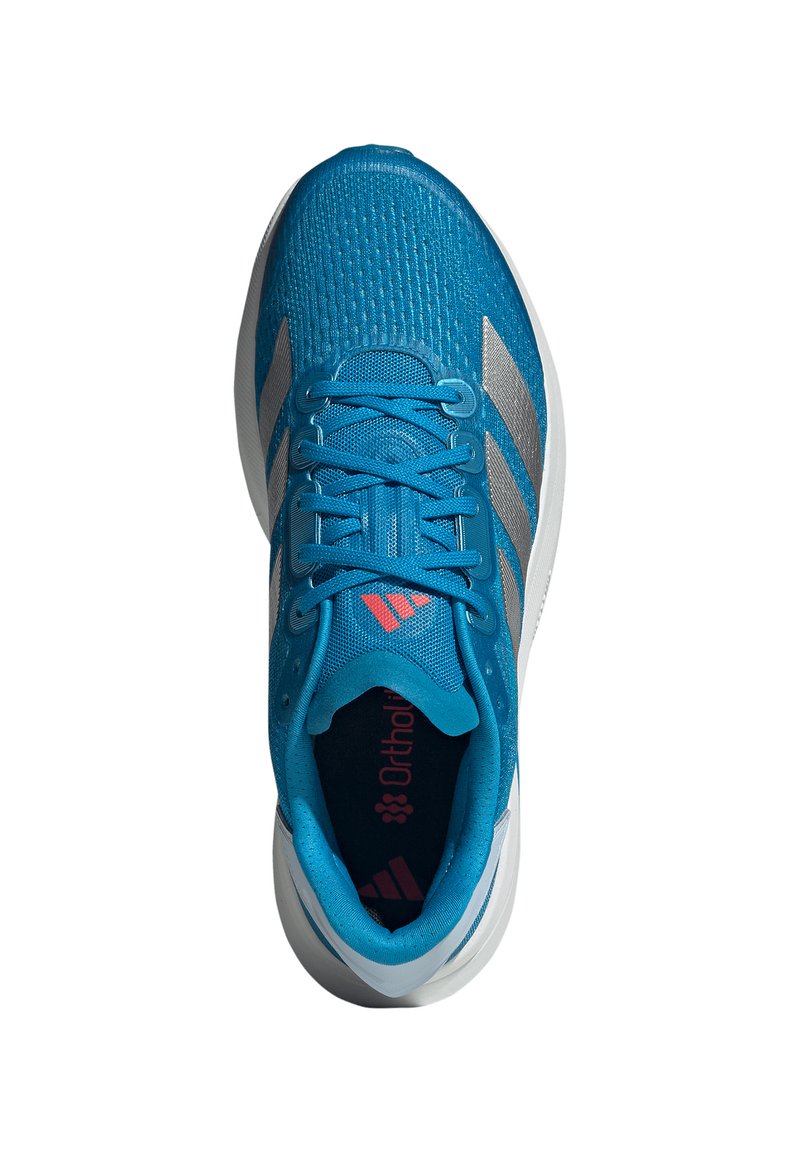 Blue athletic shoe with a textured mesh upper, silver stripes, pink logo, and traditional lacing system. Ortholite insole visible.