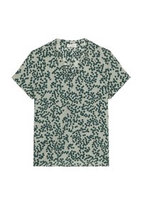 Blouse verte à manches courtes avec un motif de petits pois verts foncés dispersés, dotée d'un col en V et d'un tissu léger et texturé.