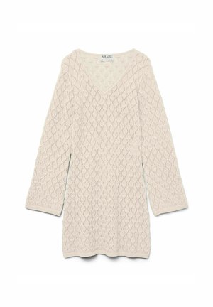 Kreem V-kaelusega kudum, millel on pikad varrukad ja teemantmustriga tekstuur, ribiga mansetid ja ihe.