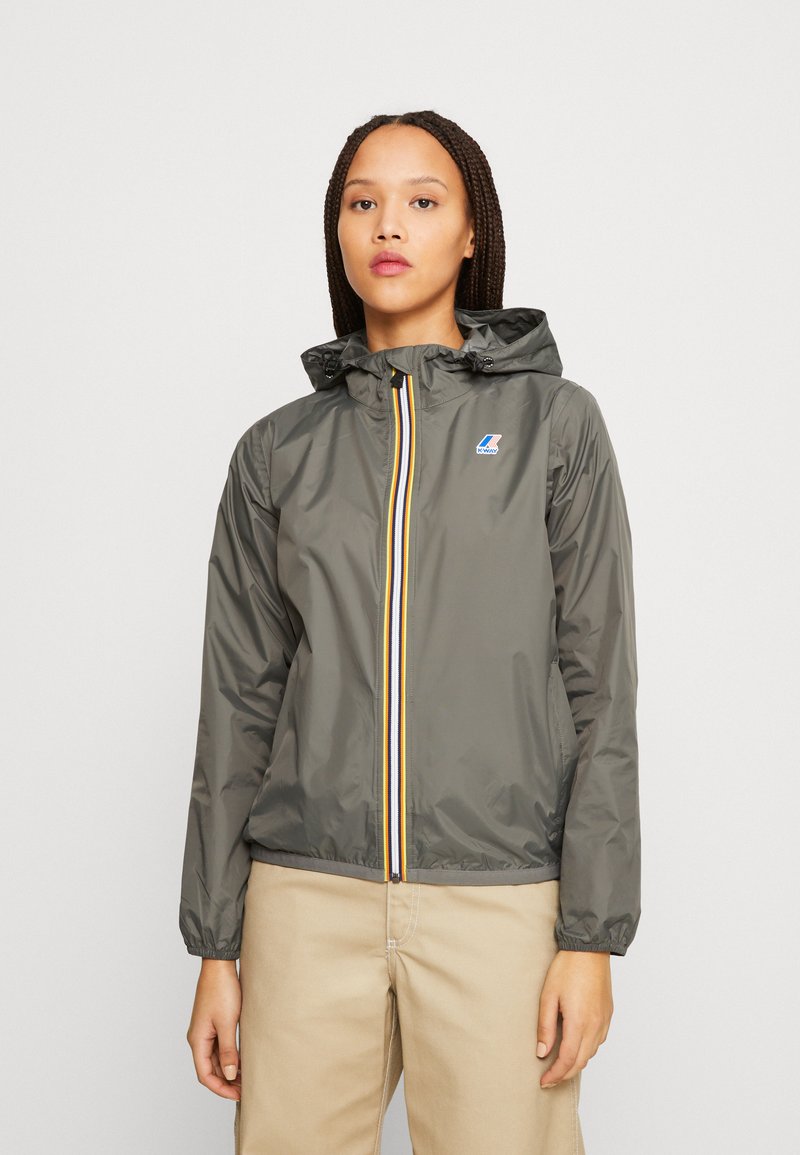 Lightweight grey jacket with a hood, featuring a yellow and blue striped zipper, elastic cuffs, and a small logo on the left chest.