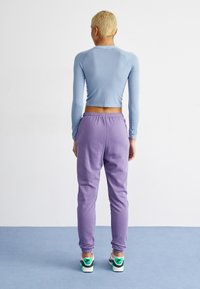 Nike Sportswear Treniņtērpa apakšdaļas - daybreak