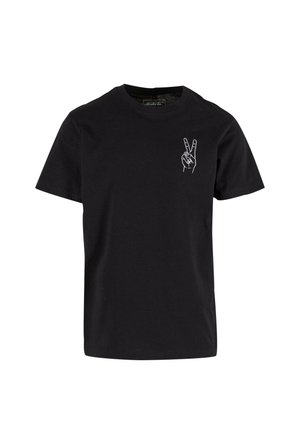 Must have lühikeste varrukatega must puuvillane t-särk ümmarguse kaelusega, mille vasakul rinnal on valge käetunnus graafika.