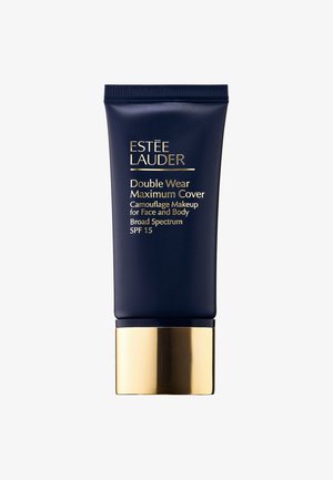 Marineblå rør med Estée Lauder Double Wear Maximum Cover makeup. Gullakenter på bunnen, med fet hvit og gull tekst på forsiden.