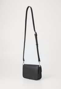 Black leather shoulder bag with a textured finish, rectangular shape, adjustable strap, and silver-tone hardware accents.