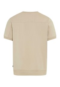 T-shirt beige à manches courtes et col ras du cou, avec poignets et ourlet côtelés, présenté de dos sur un fond blanc uni.