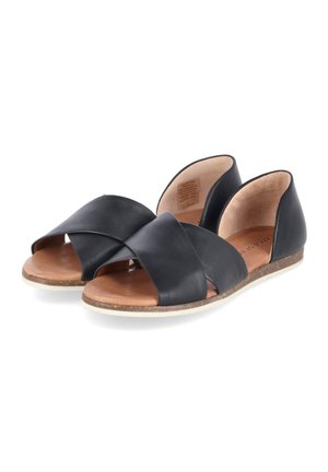 Black leather open-toe flat sandals with crisscross straps, cushioned brown insole, and low cork sole, shown from front-side angle.