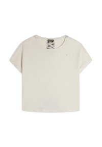 Maglietta corta di colore beige chiaro realizzata in morbido cotone. Presenta un colletto rotondo, maniche corte e un piccolo logo sul petto.