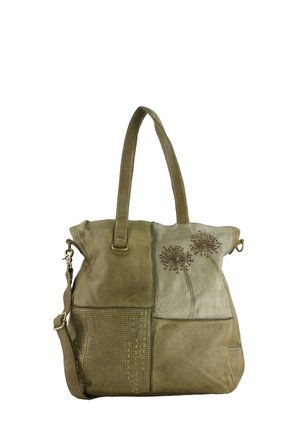 Green leather tote bag with a patchwork design, featuring floral embroidery, textured surfaces, and a perforated section. Adjustable shoulder strap.