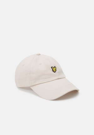 Casquette de baseball en coton beige avec une visière incurvée, arborant un logo de papillon noir et jaune sur l'avant. Design classique à six panneaux.