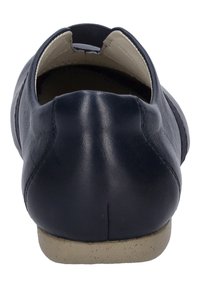 Navy leather flat shoe with a rounded toe, elastic side for easy wear, and light tan rubber sole. Smooth texture with minimal embellishments.