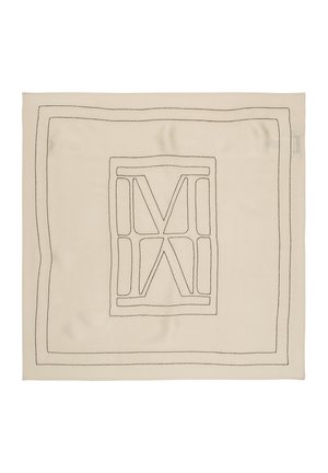 Carré de tissu beige avec une bordure à double ligne noire cousue et un motif géométrique central ressemblant à des lettres stylisées M et X.