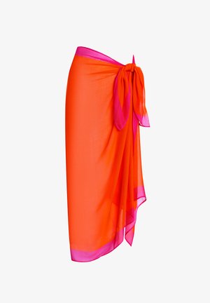 Jupe portefeuille fine orange avec une touche de rose à la taille. Elle présente une fermeture nouée et un design fluide, créant mouvement et légèreté.