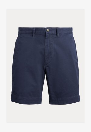 Calções azul-marinho feitos de algodão com uma textura suave, apresentando um fecho frontal com botão, passadores de cinto e uma bainha que termina acima do joelho.