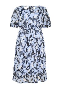 Floral dress in light blue, black, and cream. Features puff sleeves, a round neckline, and an elastic waist with a tie detail at the back.