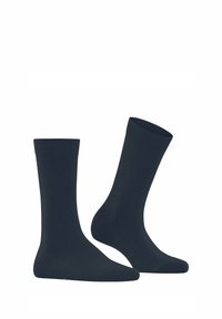Chaussettes en coton bleu marine avec bord-côtes, de longueur moyenne, texture lisse, avec un renfort aux orteils et au talon pour plus de durabilité.