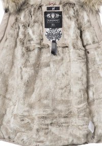 Faux fur lining in light beige with a smooth texture, featuring a label with black and white detailing and a decorative ribbon.