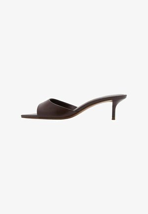 Brown slide sandals with a soft, smooth upper material, open toe, and a slim, high heel. Features a minimalist design and sleek silhouette.