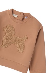 Felpa per bambini color marrone chiaro con un'applicazione in panno a forma di barboncino sulla parte anteriore e chiusura con bottoni sul retro del collo.