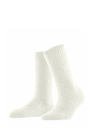 Weiße gestrickte Socken mit einem strukturierten Muster, in mittlerer Wadenlänge, mit einem gerippten Saum für einen sicheren Sitz und aus weichem, flauschigem Material.