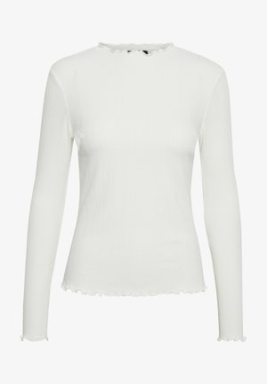 Haut blanc à manches longues avec texture côtelée et encolure et ourlet volants. Design ajusté avec manches droites et détails minimaux.