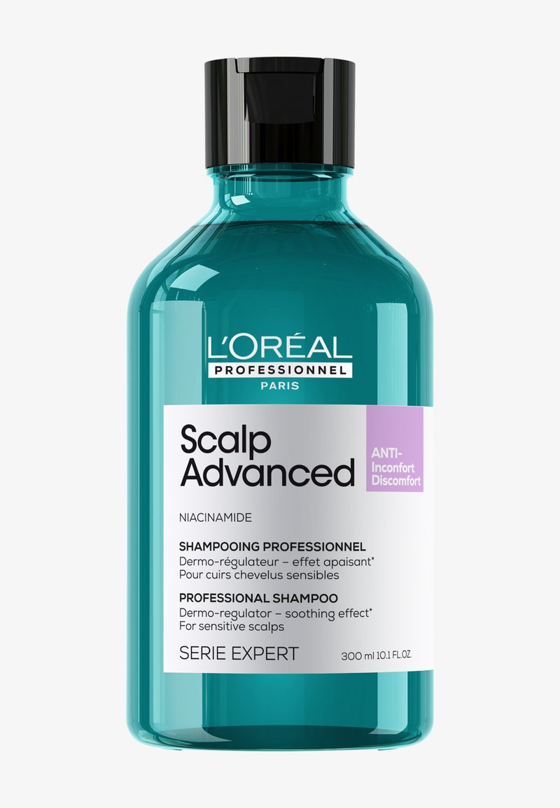 Botella de champú azul verdoso de 300 ml etiquetada como L'Oréal Professionnel Scalp Advanced, anti-malestar, niacinamida, para cueros cabelludos sensibles y efecto calmante.