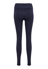 Leggings bleu marine sans couture avec texture côtelée et taille haute, avec logo Hummel embossé au centre du dos de la ceinture.