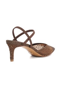 Brown heeled shoe with a pointed toe, textured upper, and cross strap design. Features a decorative, beaded heel. Smooth interior lining.
