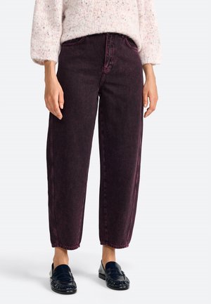 Dark burgundy high-waisted jeans with a straight cut, featuring visible seams and a slightly faded texture. Paired with black loafers.