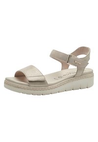 Beige platform sandals with wide toe strap and adjustable ankle strap. Soft suede material, textured sole, and contrasting woven edge detail.