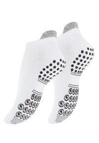 Calzini bianchi alla caviglia con cuffs grigi; la parte inferiore presenta punti e cerchi neri in gomma per la presa. Realizzati in un tessuto elastico.